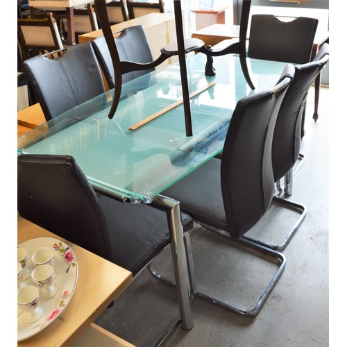 105 - A Clear Glass Topped Dining Table and Six Chrome Framed Faux Leather Upholstered Chairs (Chairs some... 