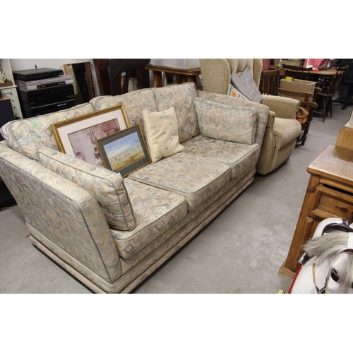 143 - A Slumberland Sofa Upholstered in Pale Coloured Fabric - on Casters