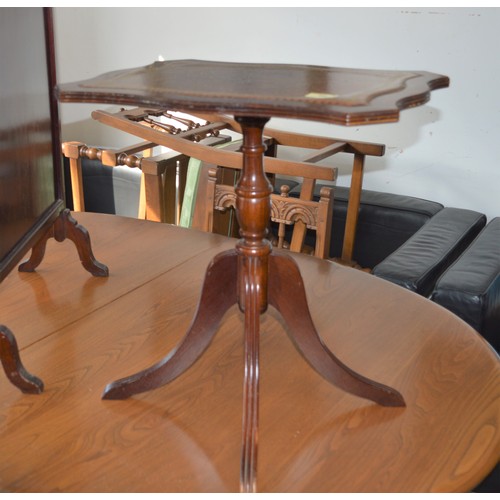 144 - Four-Branch Single Pedestal Irregular Shaped Occasional Table having Leather Inset Top