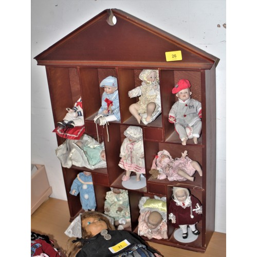 41 - Wall-Hanging Display Case with Collection of Small Dressed Dolls with Bisque Heads