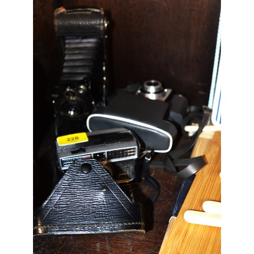 84 - Three Vintage Kodak Cameras:  An Instamatic 300, a Bantam Colorsnap, and a Pocket Kodak Series 2 No.... 