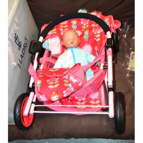 96 - Dolls Pushchair with Doll and Crocheted Blanket