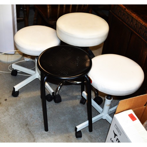 40 - Three Therapist's Single Pedestal Stools on Casters (Cream Seats), Plus One Black Metal Stool, Plus ... 