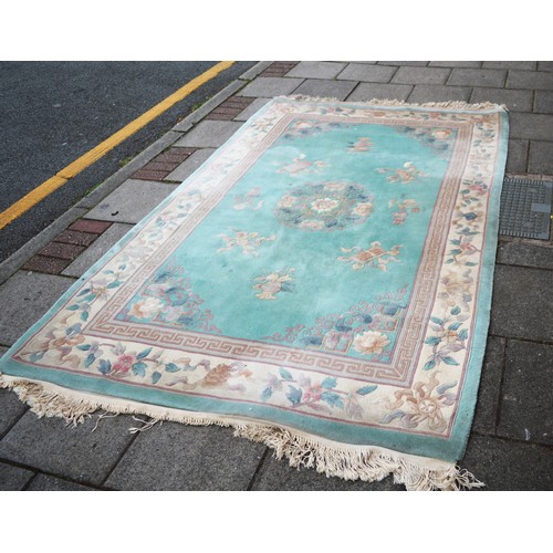 69 - Fringed Chinese Carpet on a Green Ground 12' x 5'