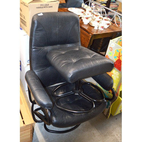 67 - Modern Black Faux Leather Recliner with Footstool, and having Tubular Steel Framework