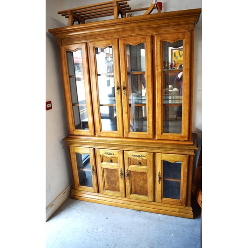 226 - An Ornate Lightwood Display Cabinet having Glazed Doors, Glass Shelves, Mirror Backs, and Decorative... 