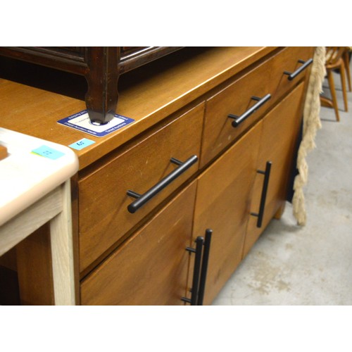 65 - Polished Solid Oak Sideboard having Three Drawers over Three Cupboards and Decorative Black Handles ... 