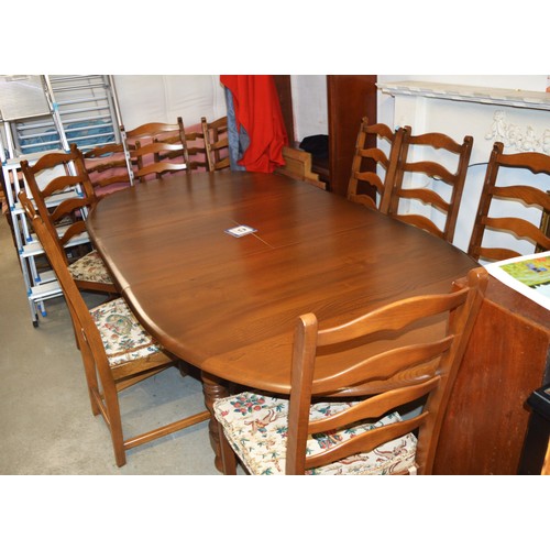 233 - Ercol Dining Table and Eight Chairs (having Ladder Backs, Slatted Seats and Press-Stud Original Seat... 