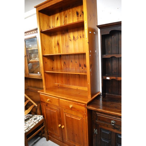 238 - Large Pine Dresser (in Two Parts) having Adjustable shelving over Two Drawers over Two Cupboards