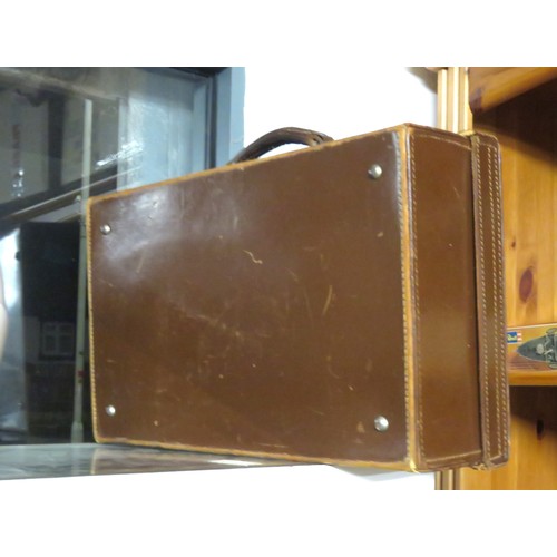 276 - A Cow Hide Suitcase