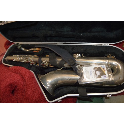 200 - An Engraved Ta Feng Long Tenor Saxophone and Hard Case.