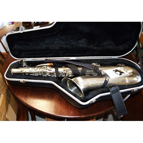 200 - An Engraved Ta Feng Long Tenor Saxophone and Hard Case.