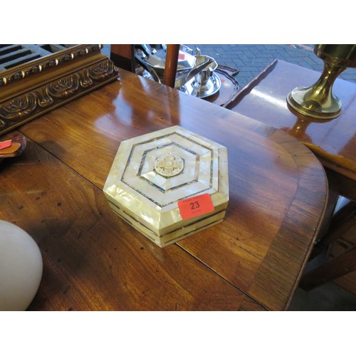 42 - An Hexagonal Mother of Pearl (Abalone) Jewellery Box with a Carved Decorative Centre having Red Velv... 
