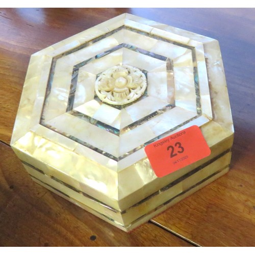 42 - An Hexagonal Mother of Pearl (Abalone) Jewellery Box with a Carved Decorative Centre having Red Velv... 