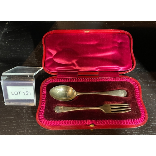 151 - Solid silver spoon and fork with the initials ALM engraved in original box probably a christening se... 