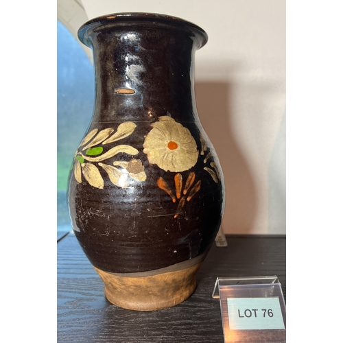 76 - 18th century slipway floral  jug in thick brown glaze