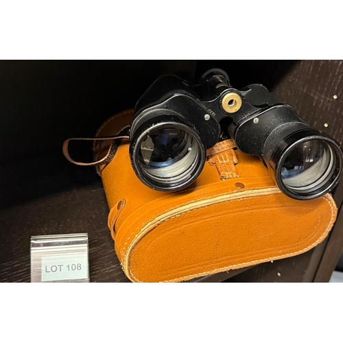 108 - Pair of early binoculars in leather case