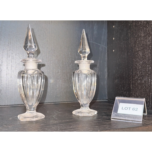 62 - A pair of small bottles/decanters