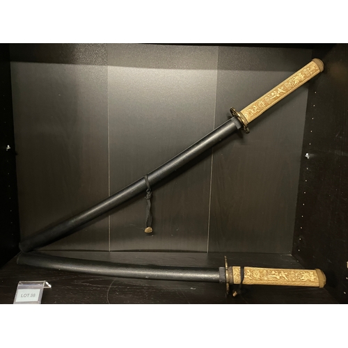 38 - Two imitation samurai sword