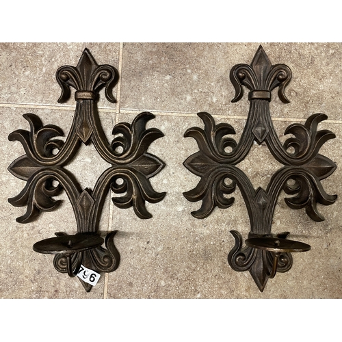 796 - A pair of cast iron candles sconces