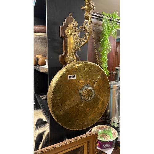 816 - Decorative brass gong complete with cherub