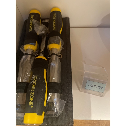 262 - A set of Work Zone wood chisels with yellow and black ergonomic handles, presented in a black fabric... 
