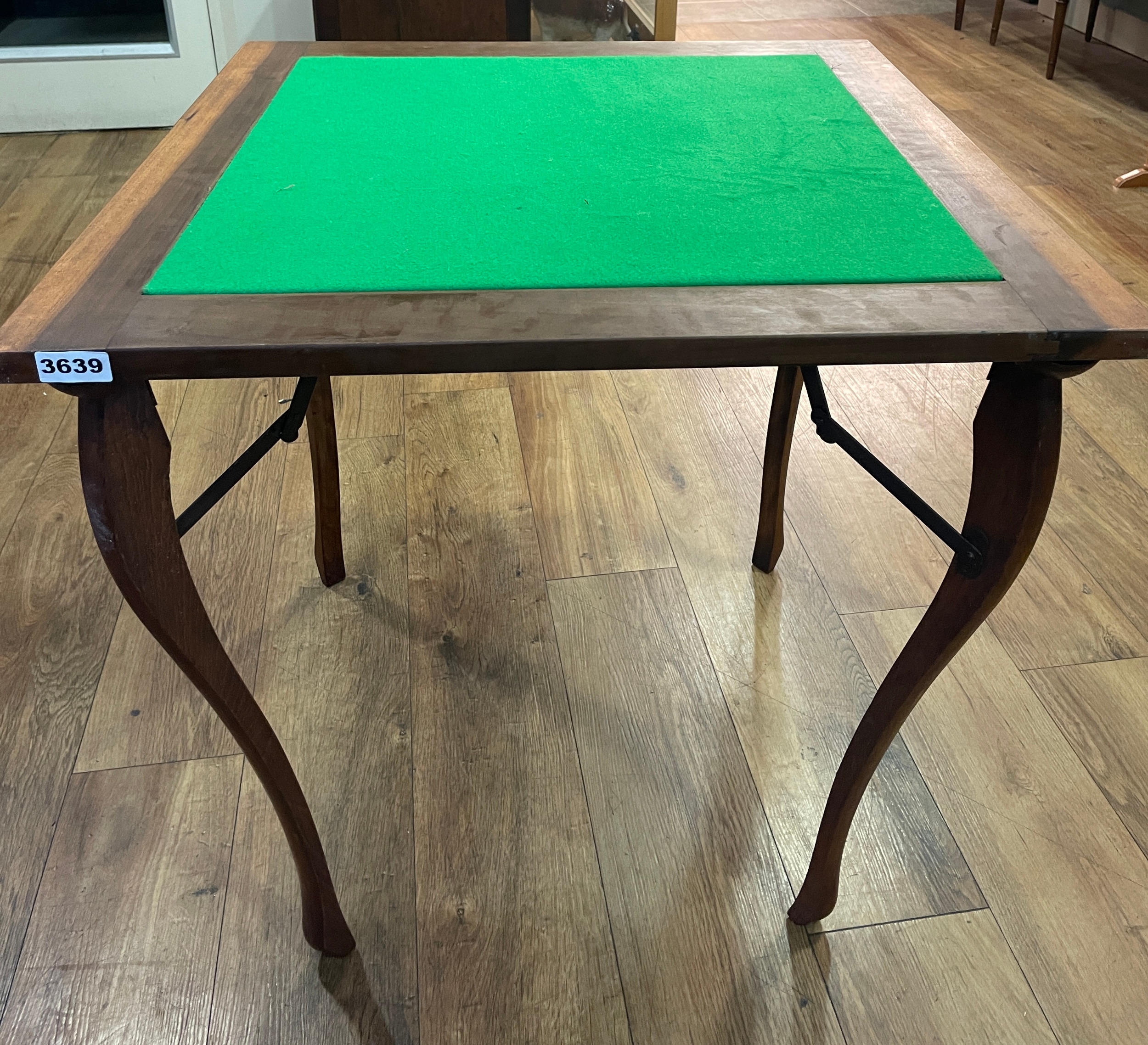 Vintage folding card table with a green baize playing surface and ...