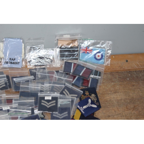 596 - LARGE QUANTITY OF RAF BADGES