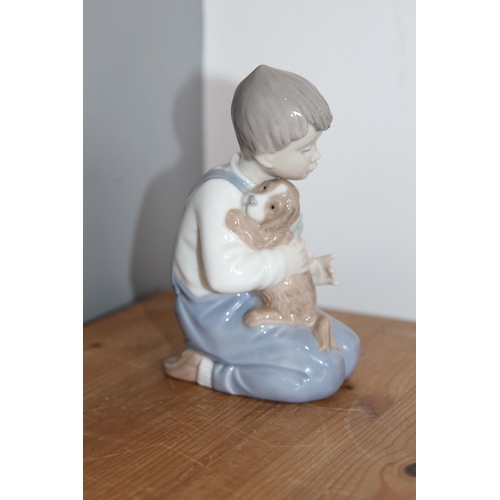 532 - NAO FIGURE OF A YOUNG BOY WITH DOG
15CM