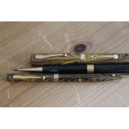 581 - VINTAGE WATERMANNS FOUNTAIN PEN AND PENCIL WITH 9CT GOLD AND A FYNEPOYNT PENCIL WITH 18ST GOLD BAND