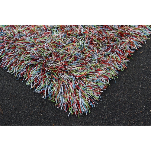 83 - HANDMADE SHAGGY RUG
180 X 130CM