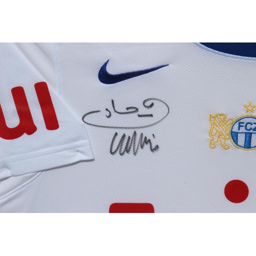 212 - FRAMED SIGNED F C ZURICH FOOTBALL SHIRT
87 X 82CM