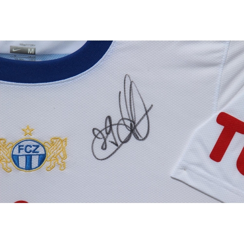 212 - FRAMED SIGNED F C ZURICH FOOTBALL SHIRT
87 X 82CM