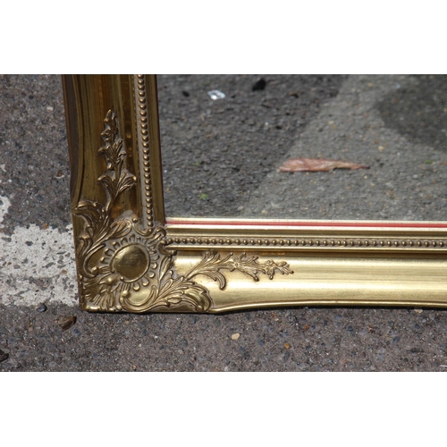 220 - GILT FRAMED MIRROR
65 X 91CM