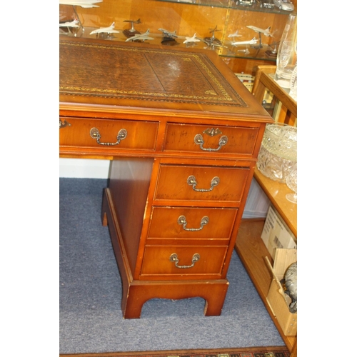 116 - REPRODUCTION LEATHER TOPPED DESK
122 X 61 X 76CM