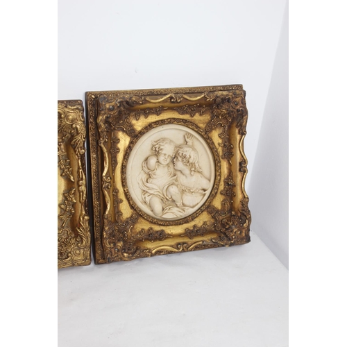 253 - 2 X ORNATE FRAMED CHERUB PLAQUES 
29 X 29CM