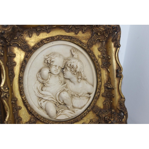 253 - 2 X ORNATE FRAMED CHERUB PLAQUES 
29 X 29CM