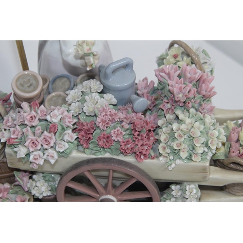 357 - LLADRO FLOWER SELLER 
27 X 33CM COUPLE OF FLOWERS ARE A/F