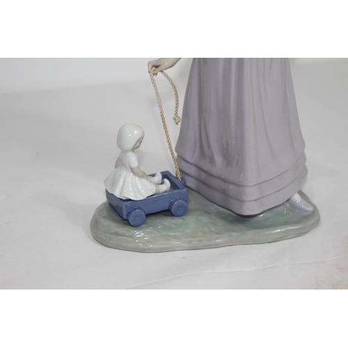 363 - LLADRO GIRL WITH DOLL ON CART
28CM