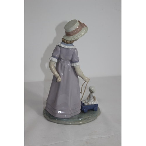 363 - LLADRO GIRL WITH DOLL ON CART
28CM