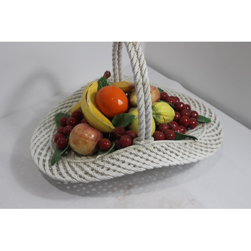 414 - LARGE PORCELAIN CENTRE PIECE BASKET OF FRUIT 
33 X 50CM