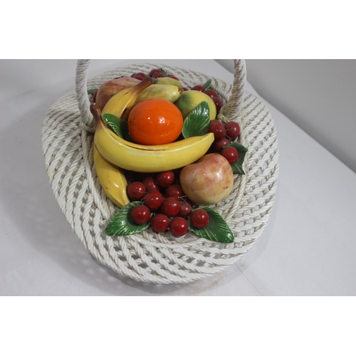 414 - LARGE PORCELAIN CENTRE PIECE BASKET OF FRUIT 
33 X 50CM