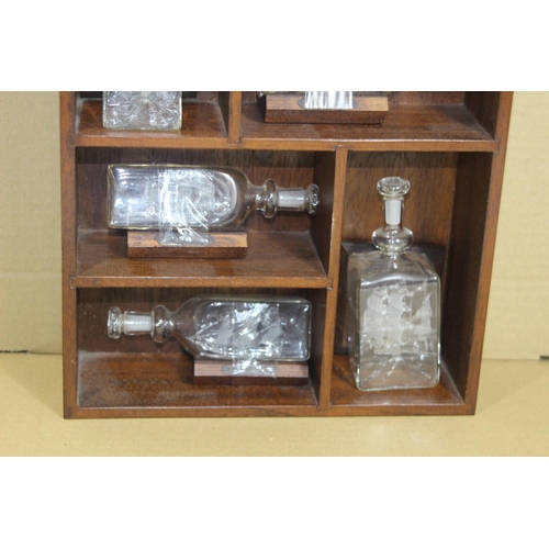 420 - DISPLAY SHELF WITH MINIATURE GLASS SHIPS IN A BOTTLE 
12CM