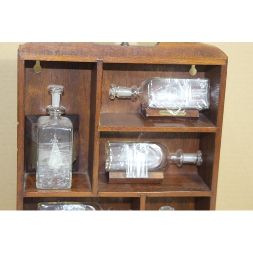 420 - DISPLAY SHELF WITH MINIATURE GLASS SHIPS IN A BOTTLE 
12CM