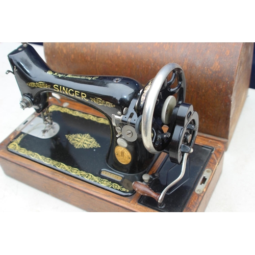 664 - SINGER SEWING MACHINE WITH KEY