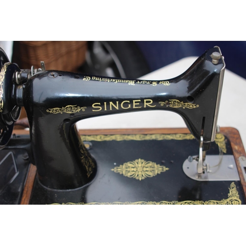 664 - SINGER SEWING MACHINE WITH KEY