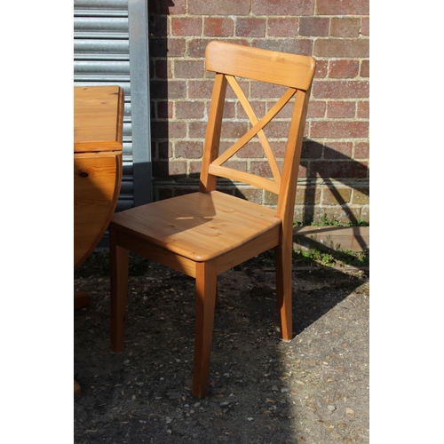 57 - PINE DROP LEAF TABLE AND TWO CHAIRS 
134 X 90 X 77CM