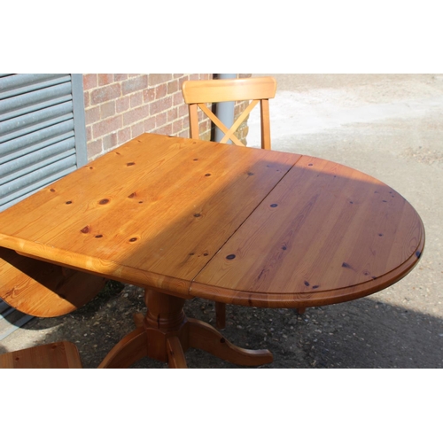 57 - PINE DROP LEAF TABLE AND TWO CHAIRS 
134 X 90 X 77CM