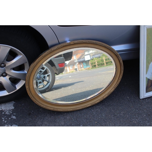 186 - OVAL GILT FRAMED MIRROR
70 X 50CM