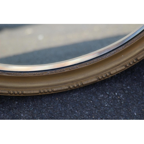 186 - OVAL GILT FRAMED MIRROR
70 X 50CM